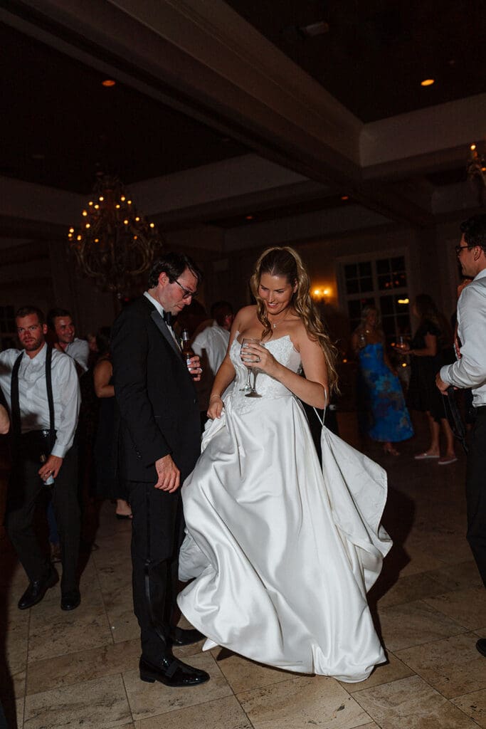 Hannah and Robert surrounded by friends and family on the dance floor